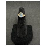 14kt ring with Aqua center teardrop stone and five