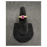 14kt Ring with oval Pink Topaz centerstone with a