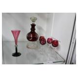 Ruby cut to clear stoppered decanter & four