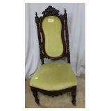 Eastlake style side chair with green fabric on