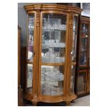 Bowfront Lighted Oak Curio Cabinet with claw-carve