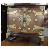 Asian locking storage cabinet with High Relief Orn