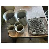 Five metal measuring cups & 4 racks