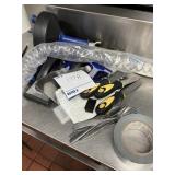 Drain, cleaner, putty knives, hose holder