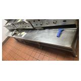 SS low 8 wheel griddle table 109" x 40" x 23"