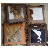 Four Hide and leather pillows with fringe