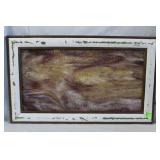 Framed slag glass panel in tan and amethyst hues