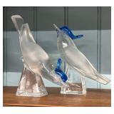 Two Lalique birds on pedestals with blue crest