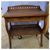 Single-drawer side table with carved crown