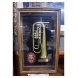 Trumpet shadowbox framed belonging to Alex Robert