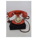 Bell System Rotary Phone in orange with stand