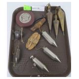 Assorted plumb bobs & mason tools