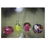 Four floral Joe St Clare paperweights