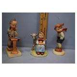 Three Hummel figures - girl with fawn, boy with sc