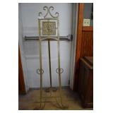 Metal easel with tin litho top lion motif
