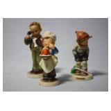 Three Hummel figures - little baker, boy with scar