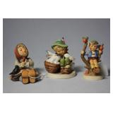 Three Hummel figures - Blackbird, bunnies & apple