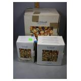 Three Hummel Figures in original box - girl with d