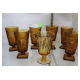 7 Amber stemmed water goblets