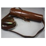 Leather wrapped brass spotting scope in leather ho