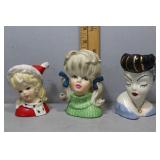 Three lady head vases - Christmas, blonde pig tail