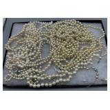 Large grouping of pearl-like necklaces, bracelets,