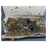 Large blue floral jewelry box filled with costume