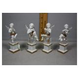 Four cherub on crystal porcelain figures