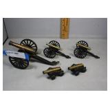 Five brass tabletop toy cannons