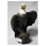 Ceramic Bald Eagle statue on rock
