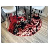 Black and red round rug