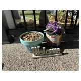 Two flower pots one concrete and one composite