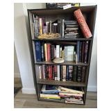 Four-shelf bookcase LOADED with books, CDs, and DV