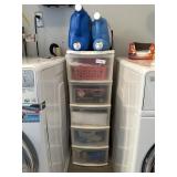 Two plastic organizers LOADED with laundry supplie