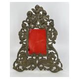 Cast metal cherub frame with hippocampus figural