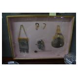 Ladies 1920s shadow box with hair combs, hat pin,