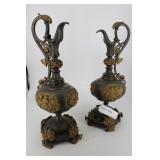 Cast metal ewers with cherubs and butterflies