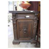 Walnut carved single door cabinet with wood pegs -