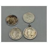 Four US Dollar coin pendants: 1887 Morgan Dollar,