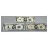 Three US $5 Silver Certificates with miscuts