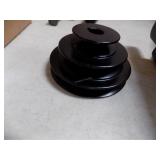 Box of misc pulleys and three tire irons