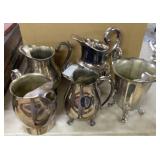 6 Silver Styled Pitchers