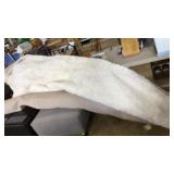 Approximately 12x12 white shag loose lay rug with