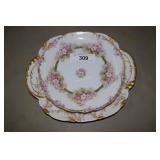 Pair of French floral decorated porcelain pieces.