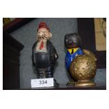 3- cast iron banks, 1- pig in blue suit, 1- USA