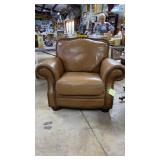 Oversized medium tan colored leather lounge chair