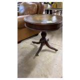 Leather topped circular end table.Single