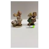 2 Hummel figurines: girl folding laundry & secret
