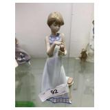 Lladro girl on phone 8"h