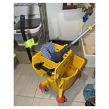 MOP BUCKET AND MOP. LOT LOCATED IN CARY